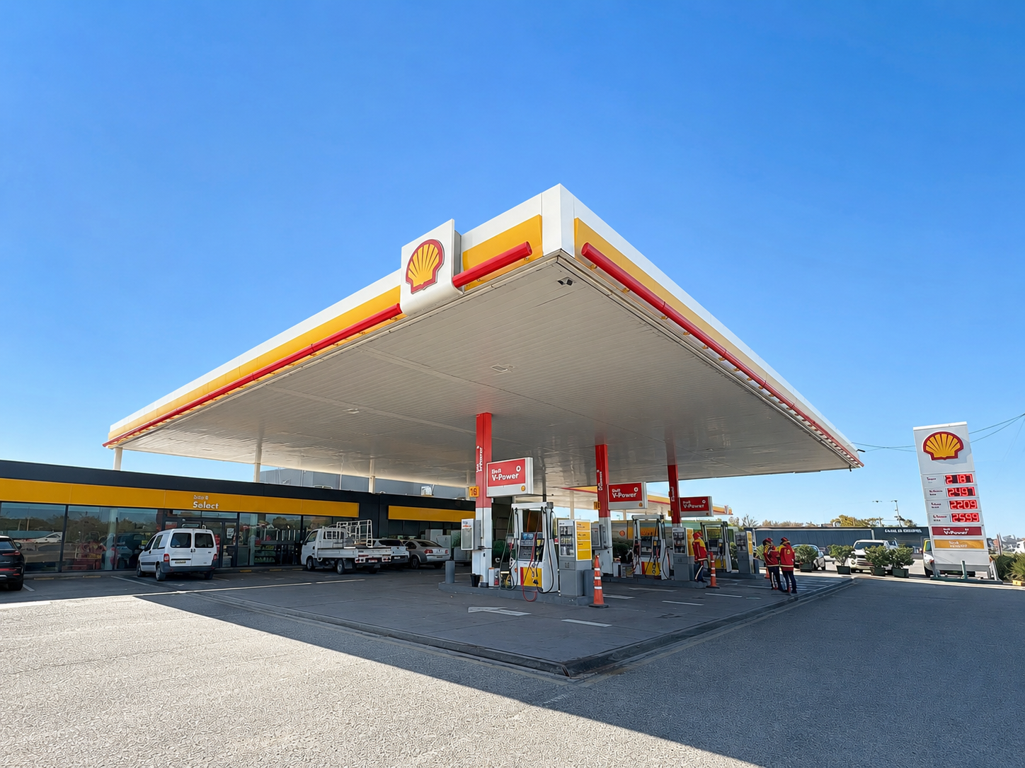 Estación Shell KM 54 sobre Panamericana: alero, surtidores V-Power, tienda Shell Select y cartel de precios